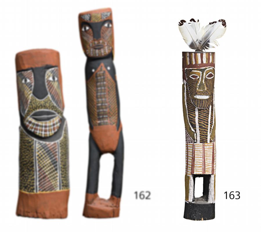 HUMAN FIGURE WITH FEATHERED HEAD ORNAMENT