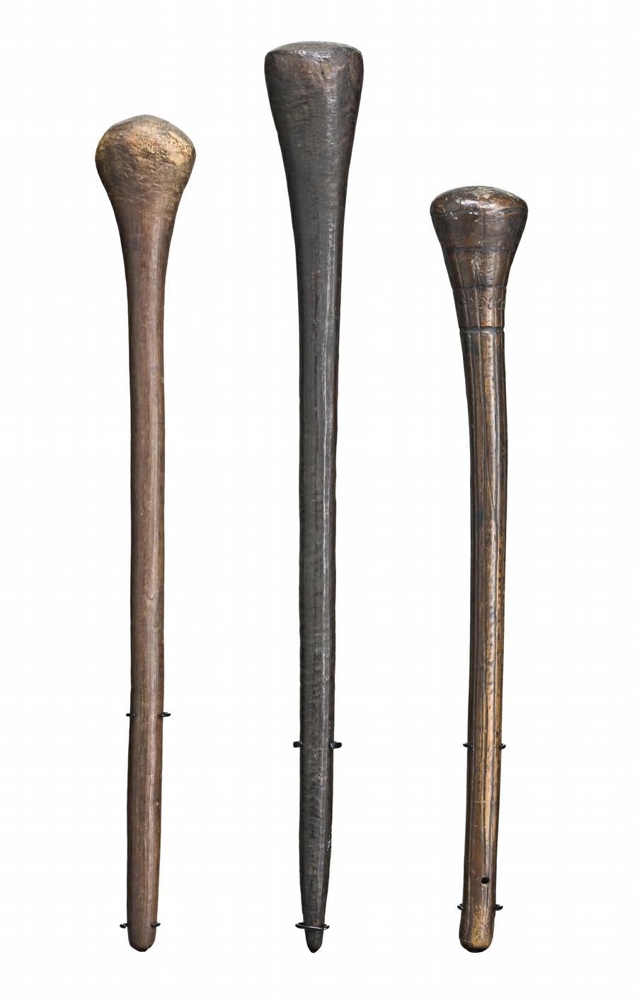 THREE THROWING CLUBS