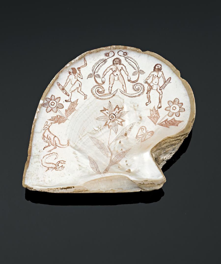 AN ENGRAVED PEARL SHELL