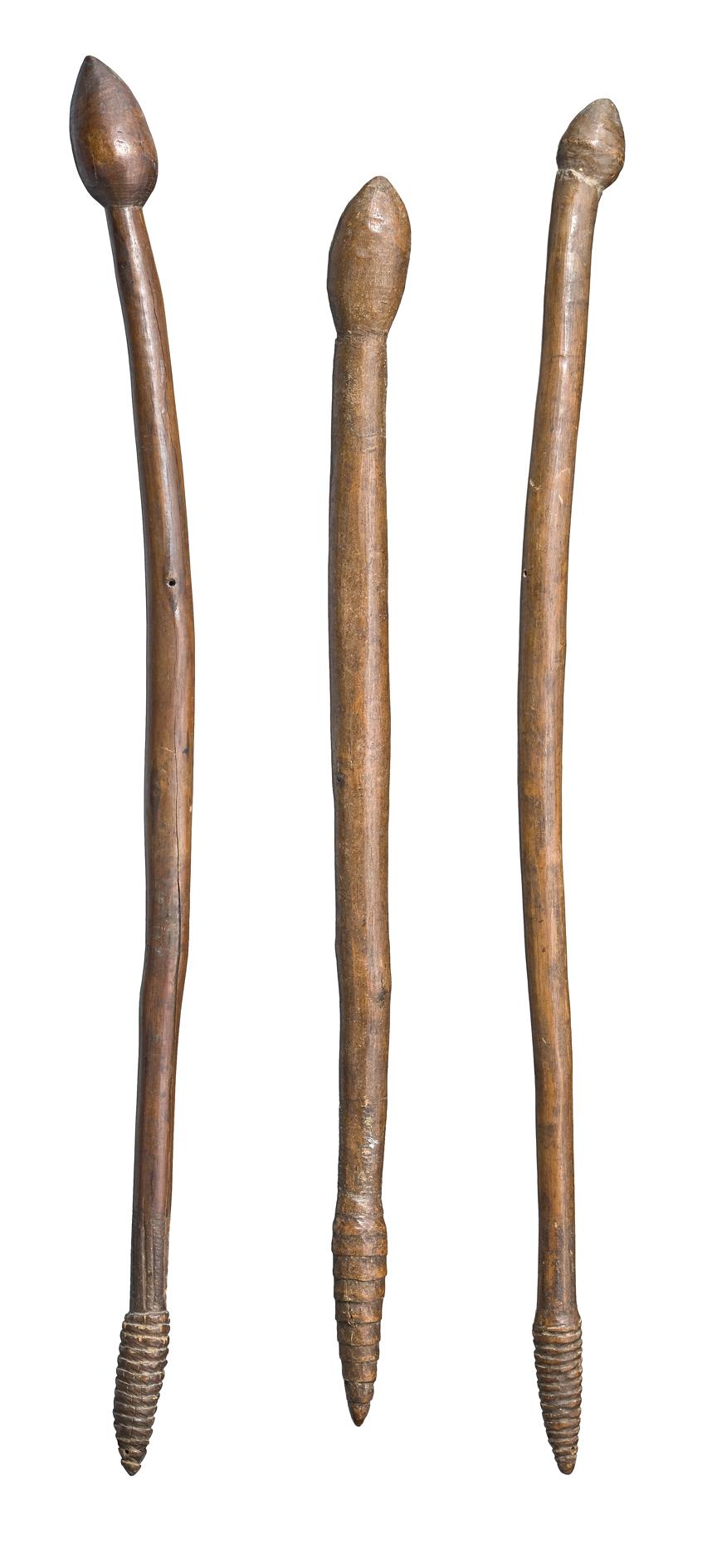 THREE BULBOUS-HEADED THROWING CLUBS