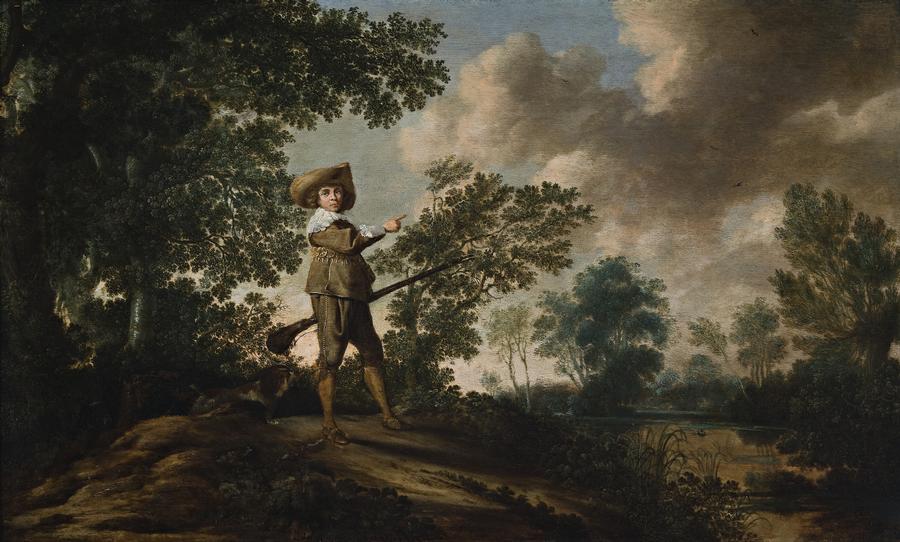YOUNG HUNTSMAN IN A WOODED LANDSCAPE WITH LAKE c.1625