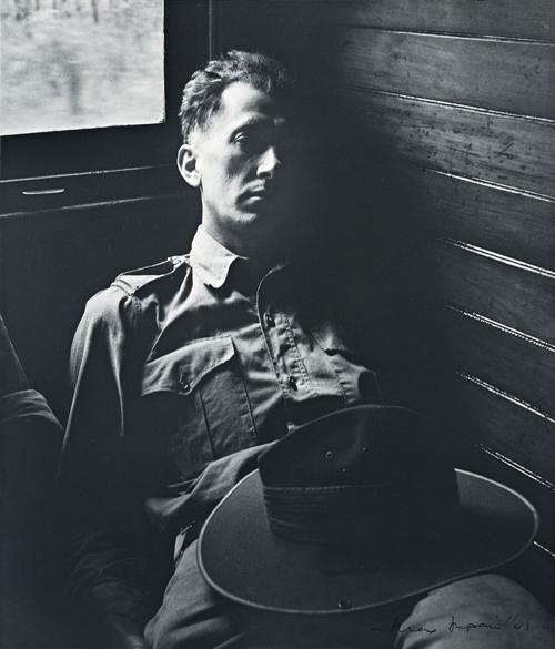 TIRED SOLDIER IN QUEENSLAND TRAIN