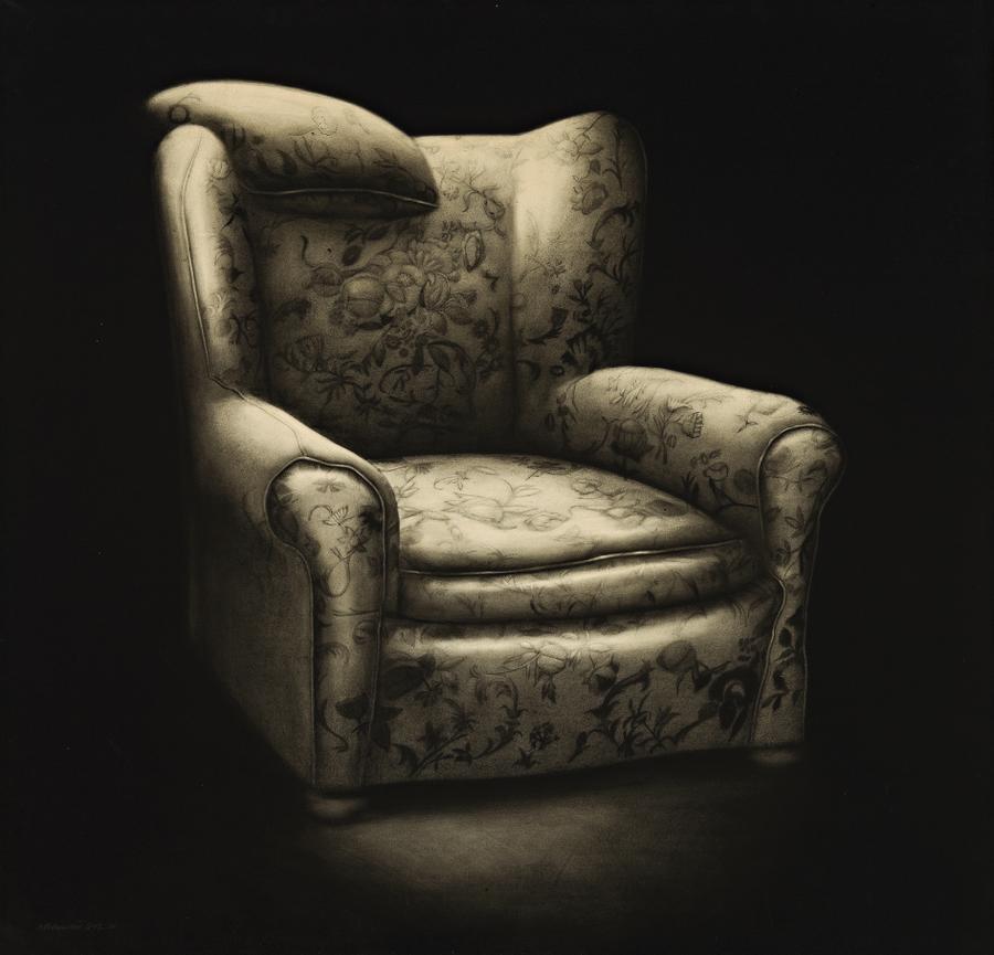 A CHAIR WITH A CUSHION ON IT