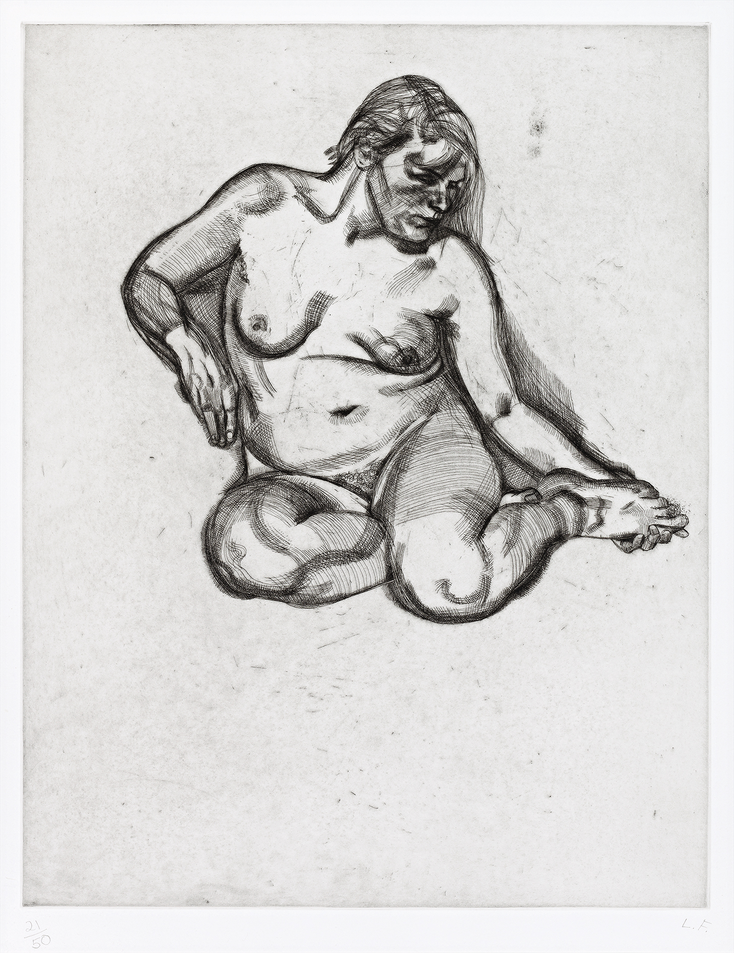 GIRL HOLDING HER FOOT