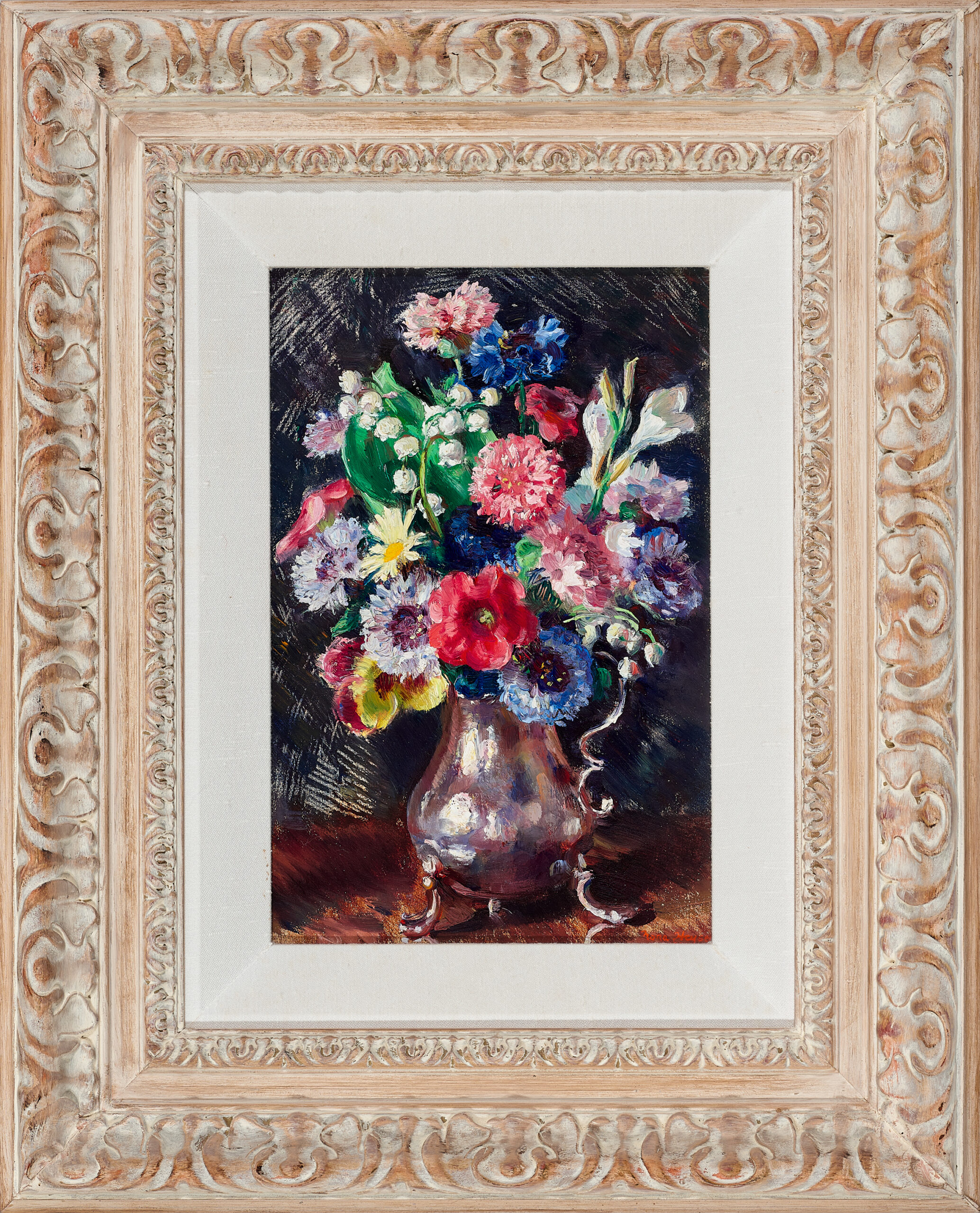 Mixed flowers in a silver jug
