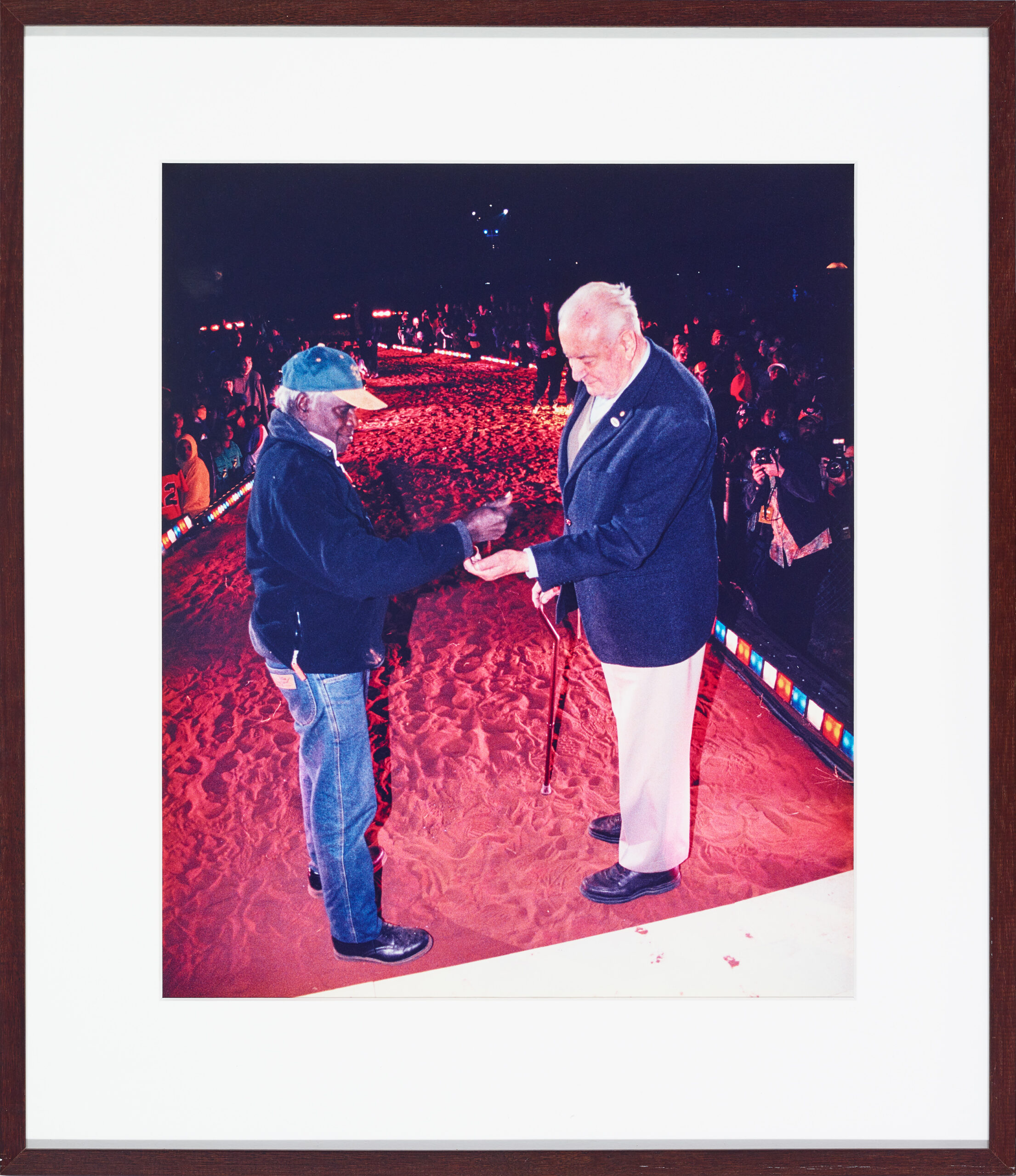 VICTOR LINGIARI, SON OF VINCENT LINGIARI, POURS SOIL IN THE HAND OF THE FORMER PRIME MINISTER GOUGH WHITLAM AT YEPERRENY