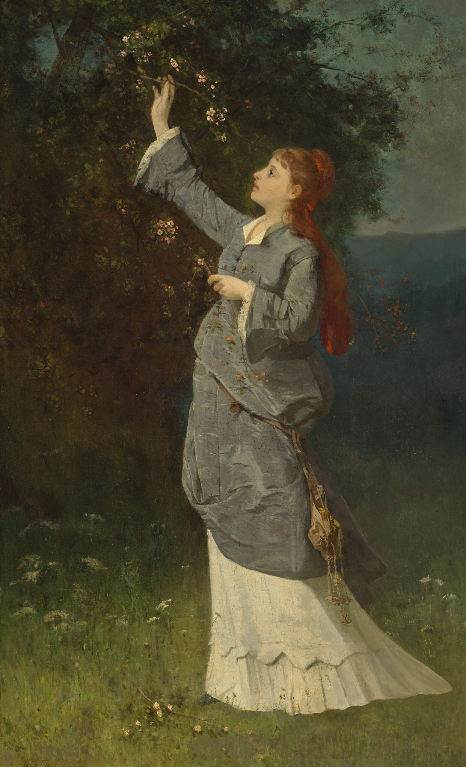 WOMAN PICKING BLOSSOM